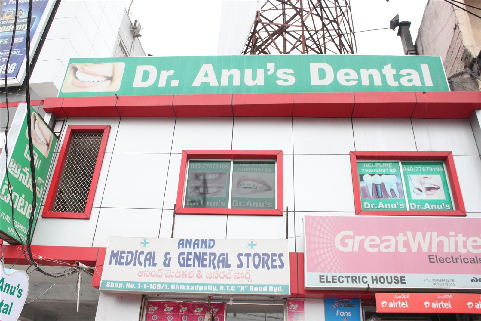 Street front of Anu's Dental Care on RTC X Road, Chikkadpally, with the green Dr. Anu's Dental sign