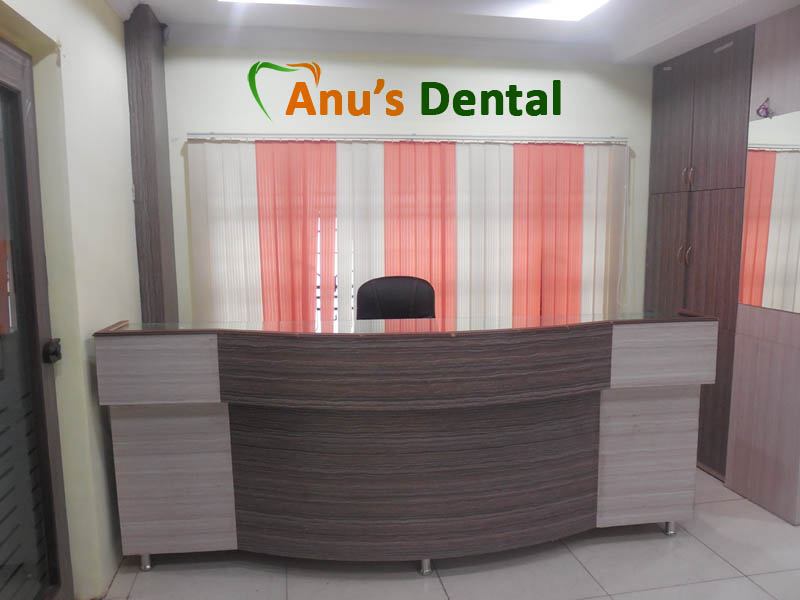 Reception desk at Anu's Dental with orange and cream curtains